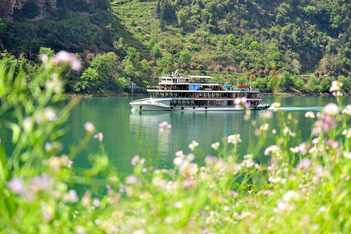 Visitors cruise around the Three Gorges Dam in Hubei
