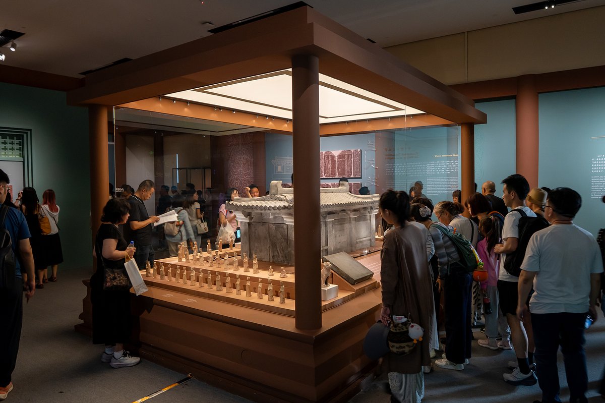 The 1.9-meter-long sarcophagus is carved in the style of a three-bay palace hall of its era