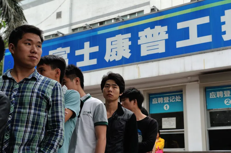 Young Chinese stand in line for searching for employment