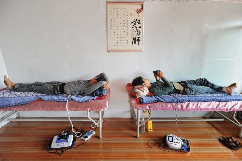 Inside a village clinic operated by Dr. Qin Junwen in a village doctor in Guizhou China