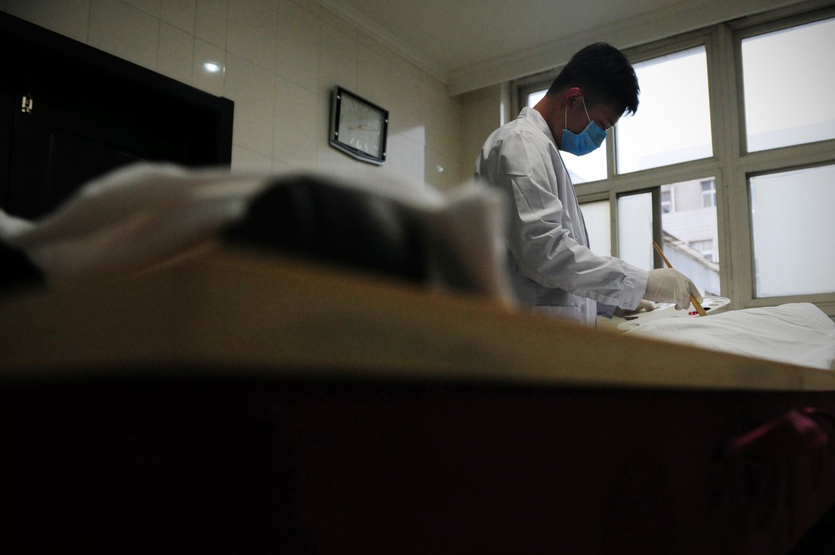 Zhang Ming, a young mortician in Qingdao, Shandong province