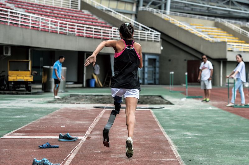 A para-athlete in Chengdu runs with a prosthetic leg
