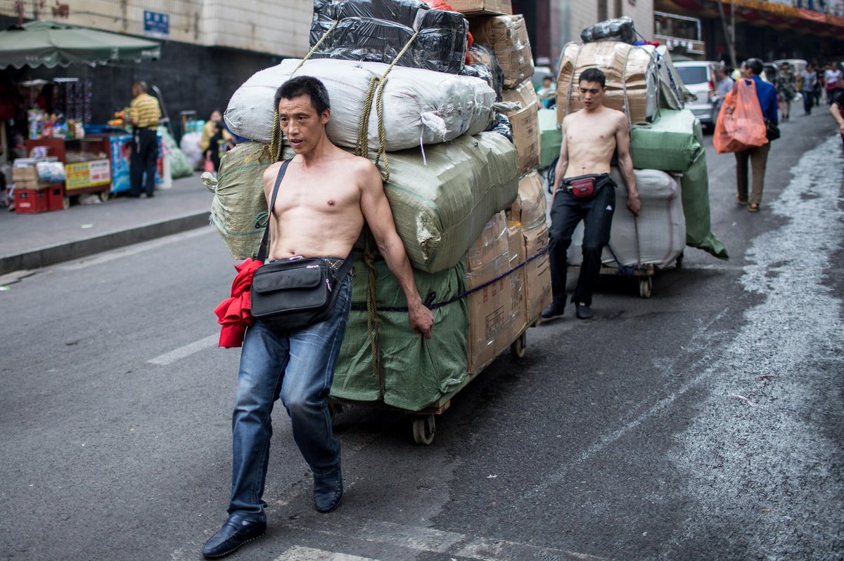 Chongqing workers carrying heavy loads down the steep slopes of Chongqing