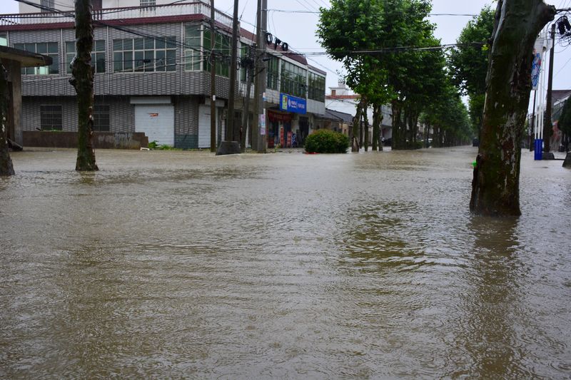 Homes and fields were submerged in Wuwei county, Anhui province, to protect the city of Wuhu in July 2016