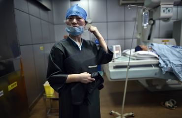 Female Chinese doctor preparing