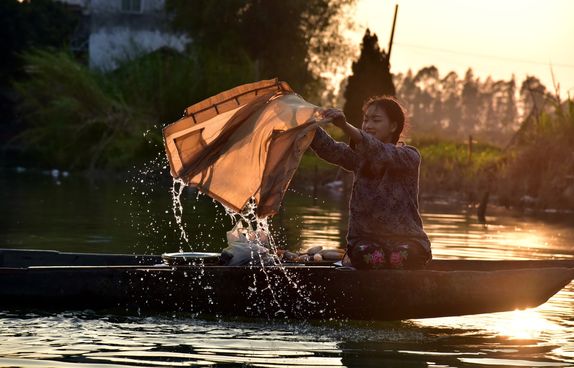 Girl washing clothes in Guangdong