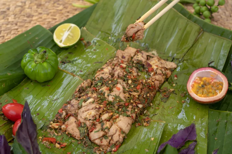 Barbecue in Xishuangbanna can include grilling meat in leaves
