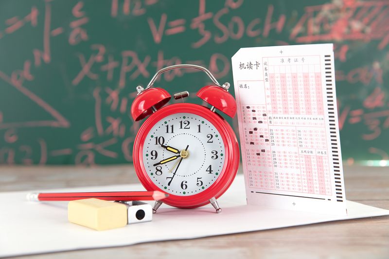 A red timer and a test score sheet, Gaokao challenge