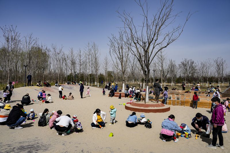 Children playing in a city park in Beijing