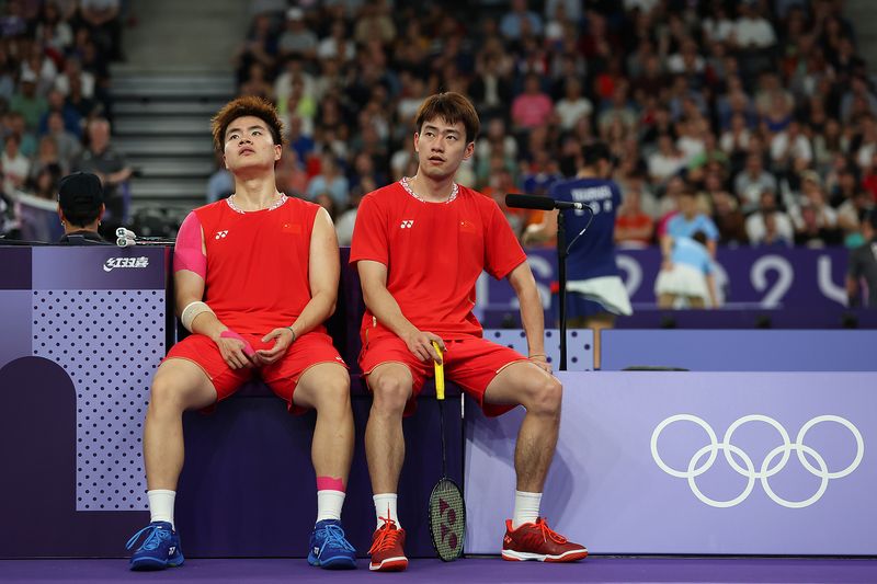 Chinese badminton players Wang Chang and Liang Weikeng at Paris 2024 Olympic