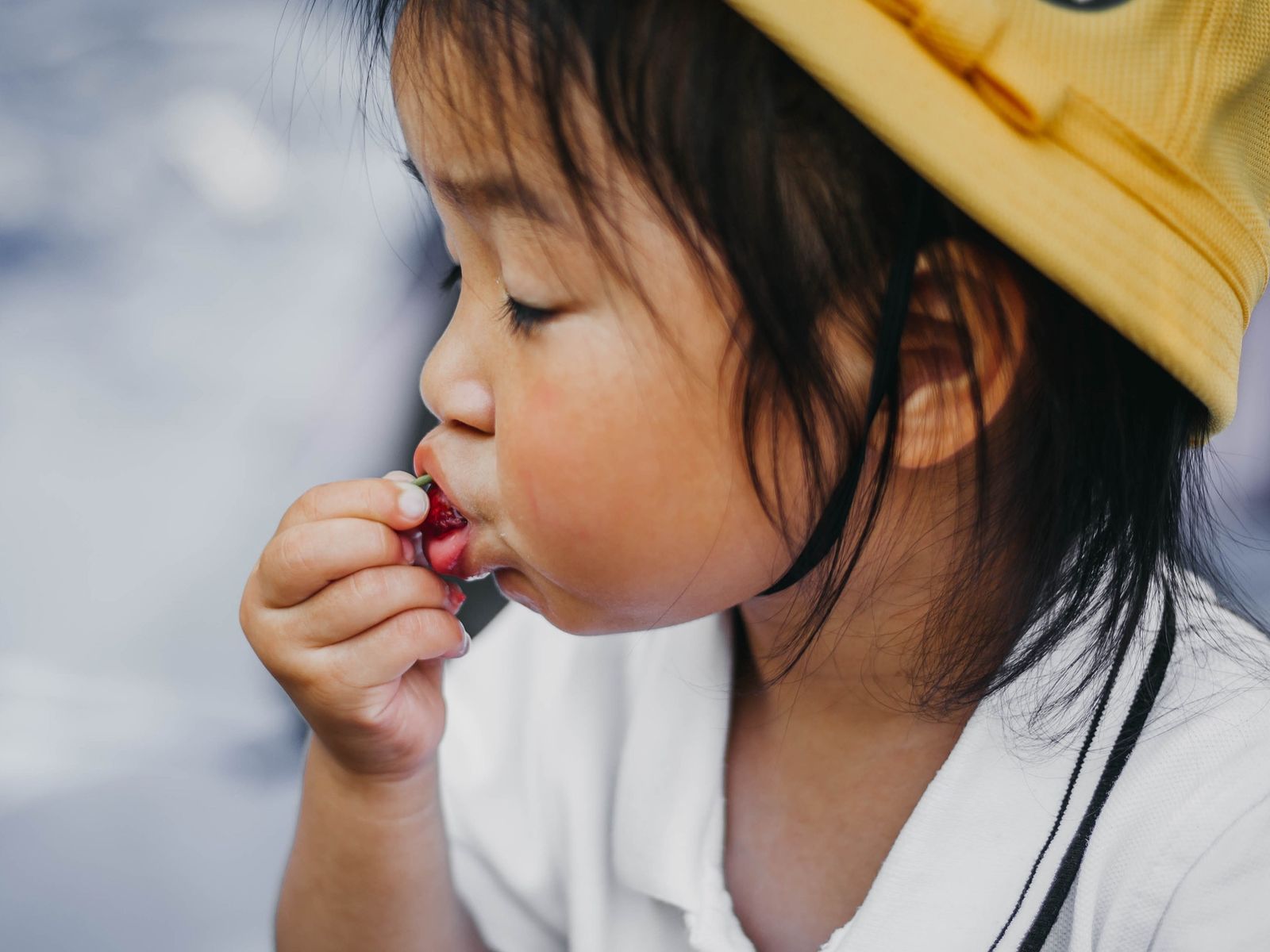 Young kid enjoying some berries