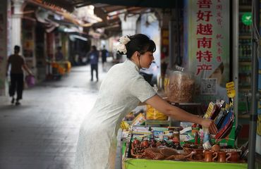 Woman selling specialty products from Vietnam in Dongxing, Guangxi