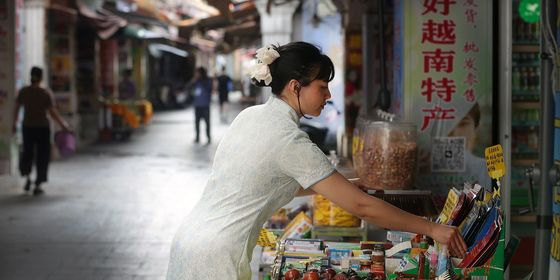 Woman selling specialty products from Vietnam in Dongxing, Guangxi