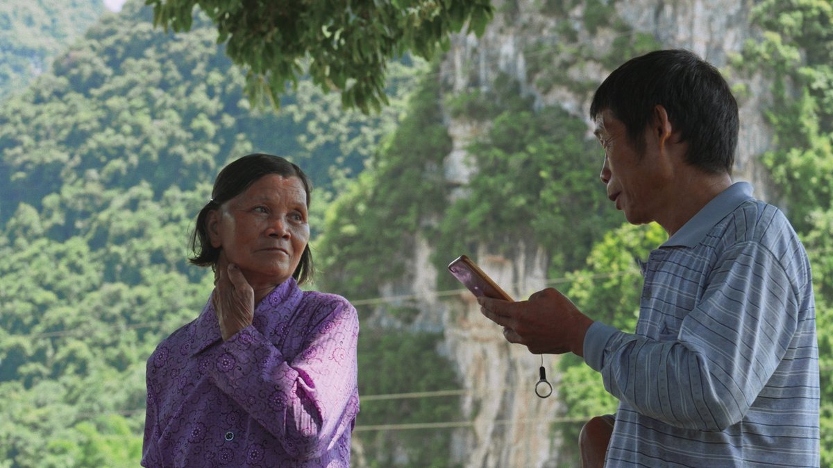 A woman and a man improvising lyrics in The Mountains Sing