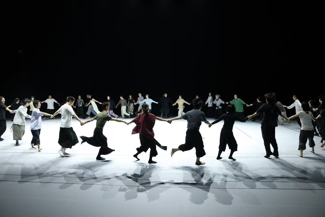 Just before the performance, dancers from TAO Dance Theater invite the audience to join hands and dance together during rehearsal at West Bund Theatre
