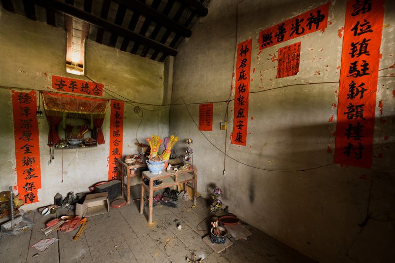 A statue of the local god of the land once sat in this small room in the tulou