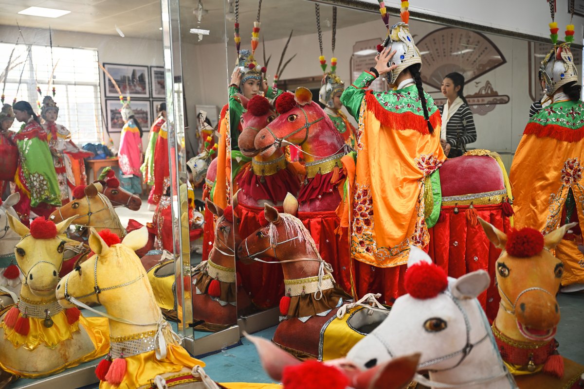 Performers getting ready in the training room before a parade