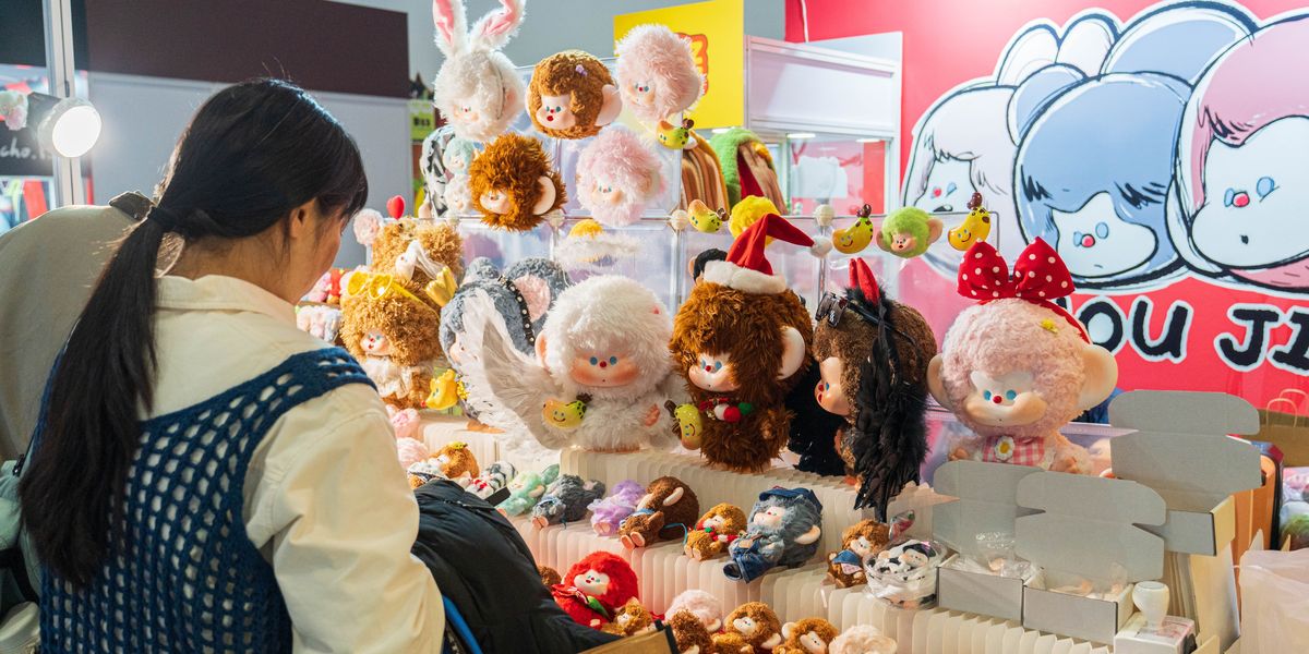 Young Chinese purchasing designer toys and plushies
