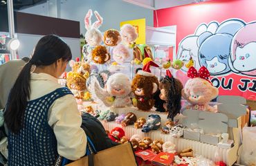 Young Chinese purchasing designer toys and plushies