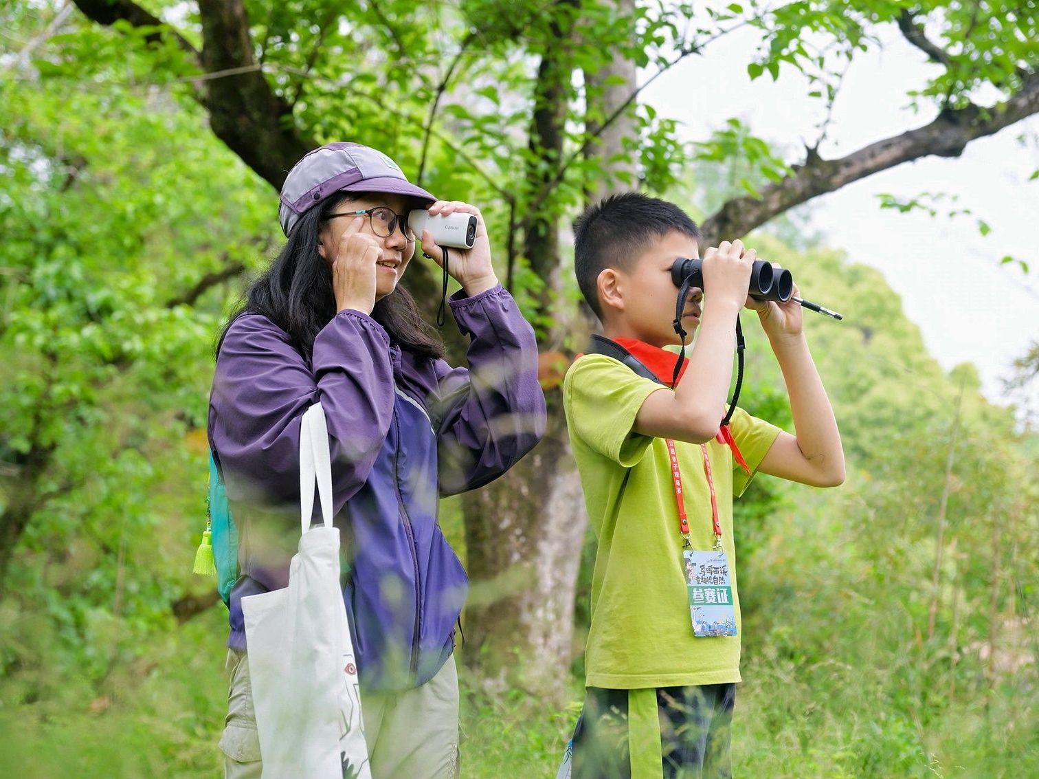 Young Chinese birding at a park