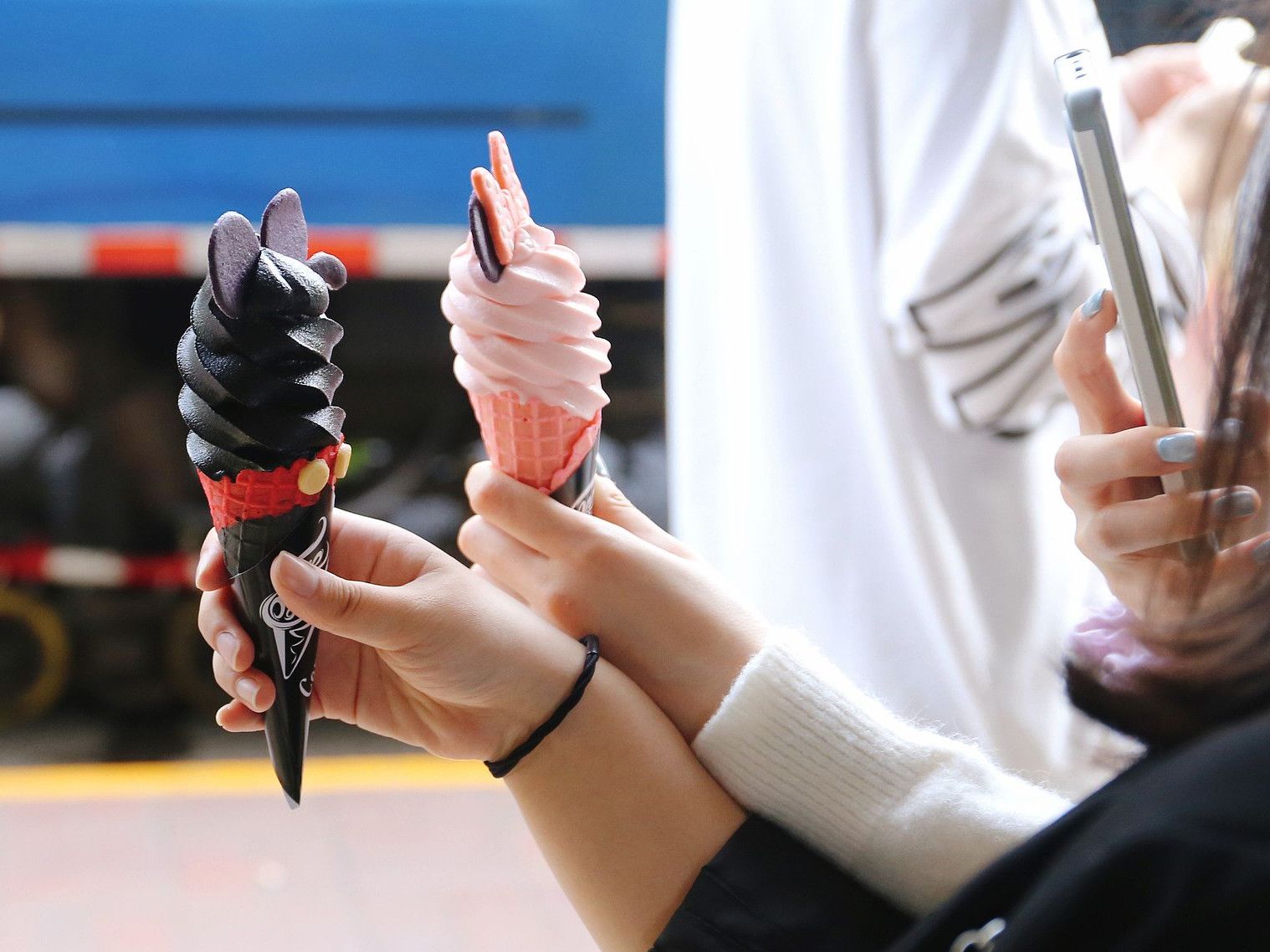 Young Chinese taking photos gelato