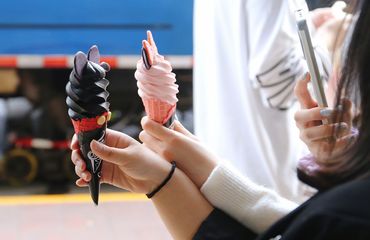 Young Chinese taking photos gelato