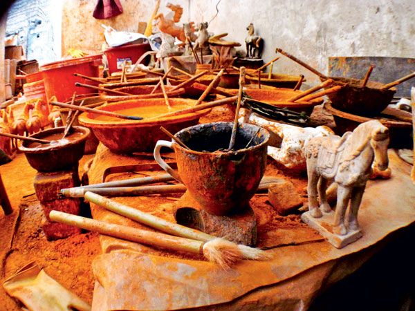 Nanshishan Village's craftsmen take great care in making their fake antiques as real as possible