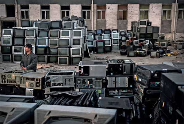 Electronics graveyards like this one outside Beijing are a lifeline for Beijing's recyclers