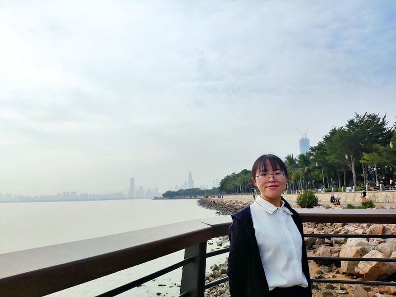 Tong Can, one of the featured article's inspiring and disabled Chinese women takes a picture near a river in Tianjin.