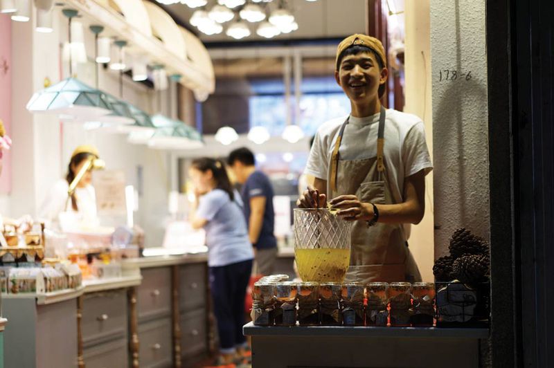 A local drinks vendor welcomes tourists