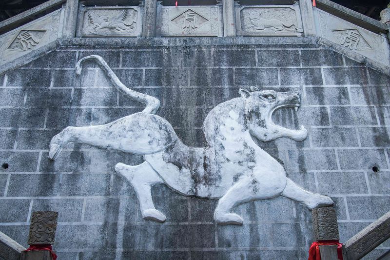 A White Tiger emblem on the front wall of Linjun Temple in Enshi, Hubei province