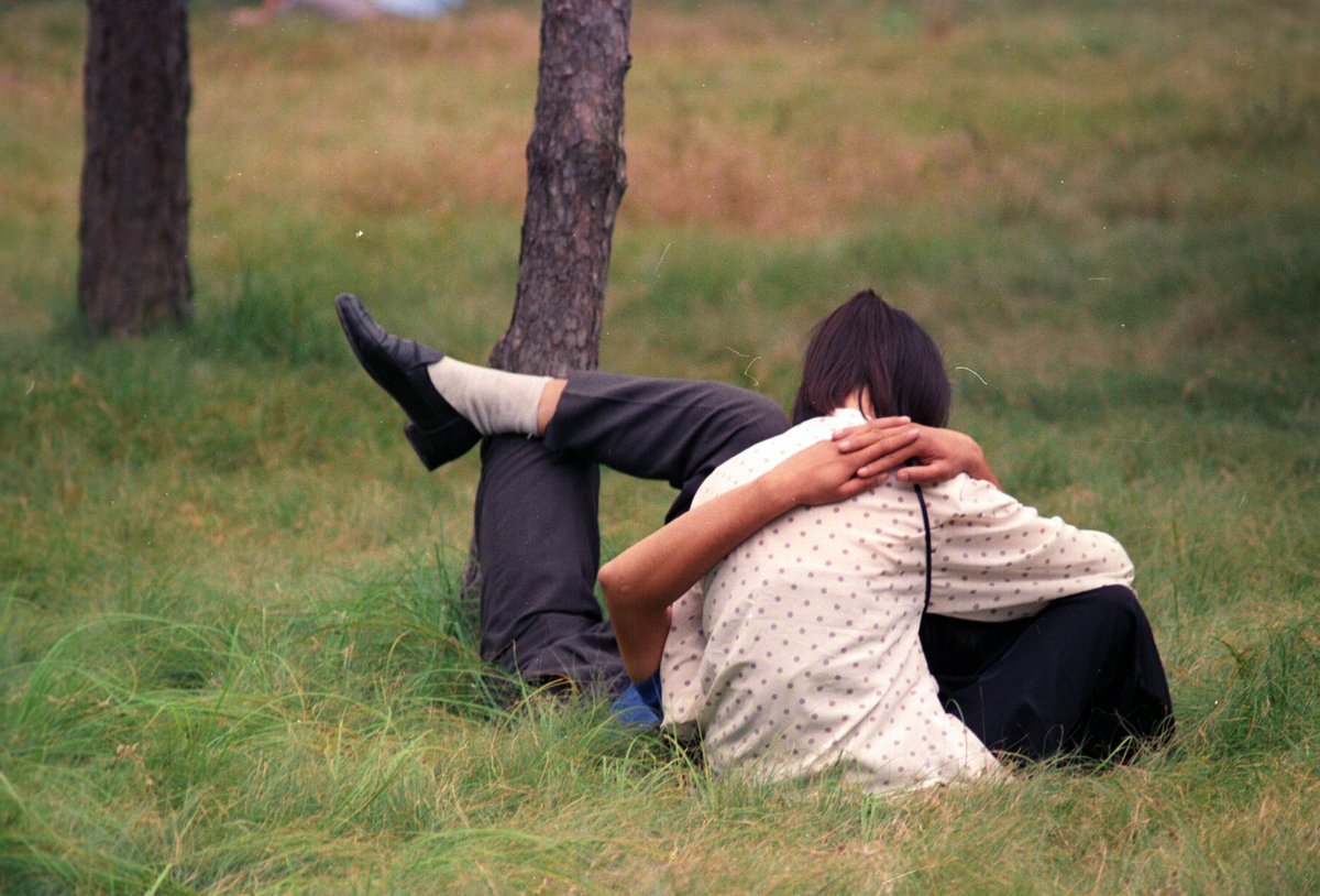 Couple kissing in park