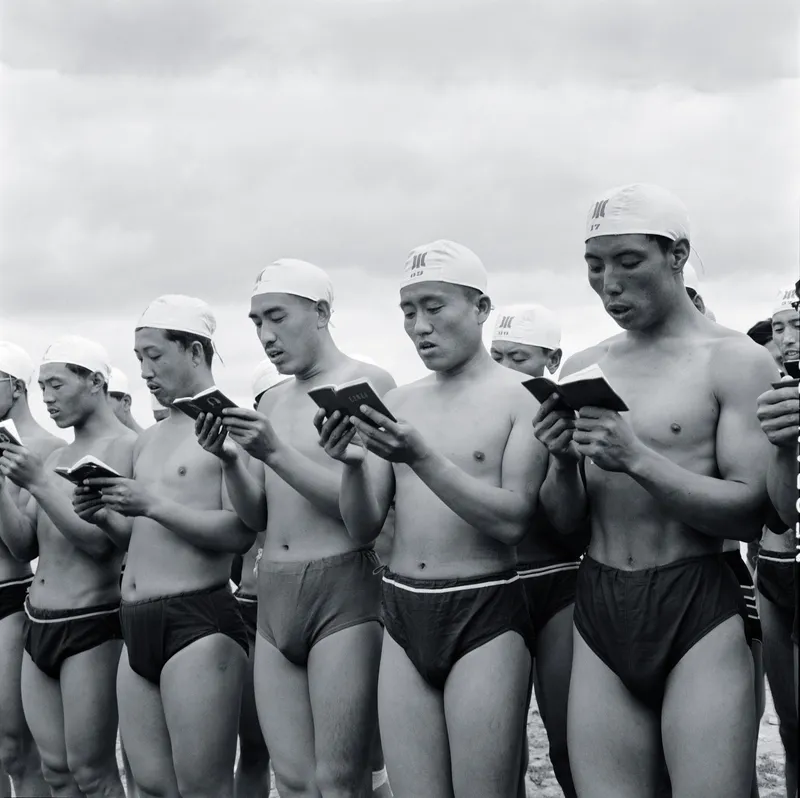 July 16, 1968: Swimmers read from the ”Quotations of Chairman Mao” on the second anniversary of Mao’s Yangtze crossing, before plunging into the Songhua River