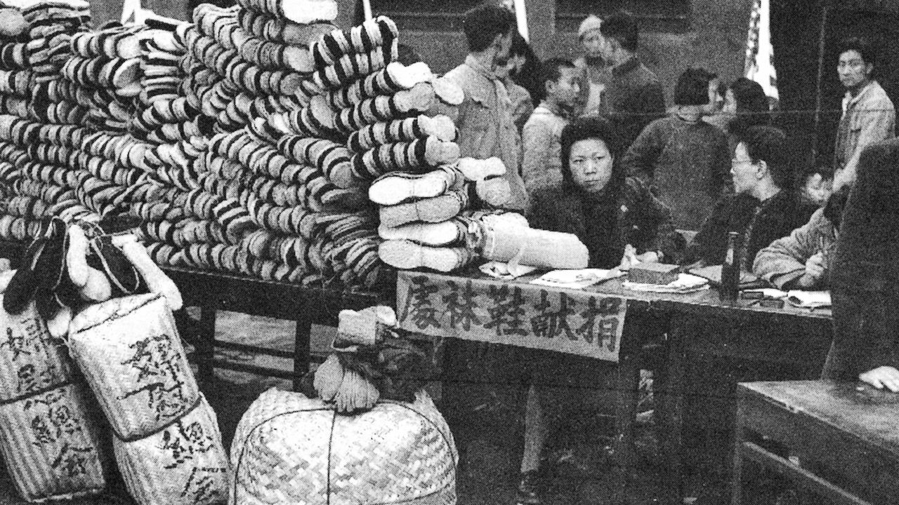 A member of the Women’s Federation, a forerunner to the ACWF, taking donations of clothes, shoes, and socks for civilians and soldiers wounded during war with Japan, in Chongqing on March 8