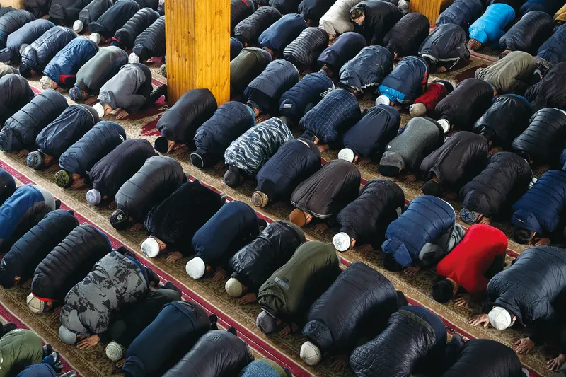 Dungans prostrate themselves during Friday Prayer in Milyanfan