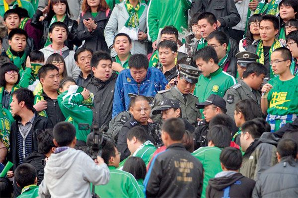 Throwing drinks and minor brawls are staples at Guo'an games