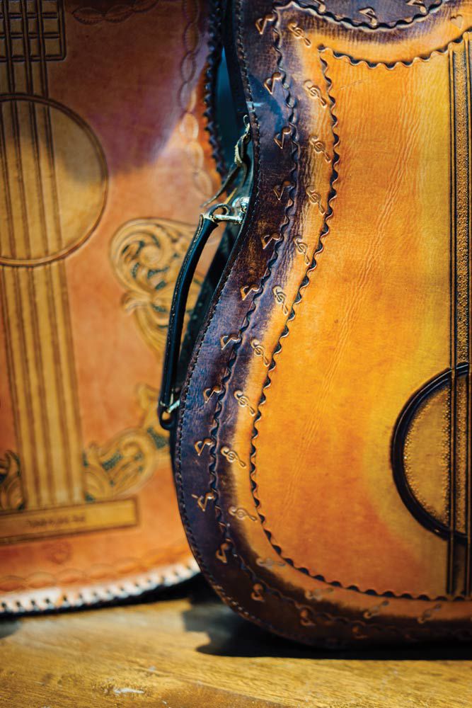 A custom-made bag in the shape of a guitar, sold to a musician