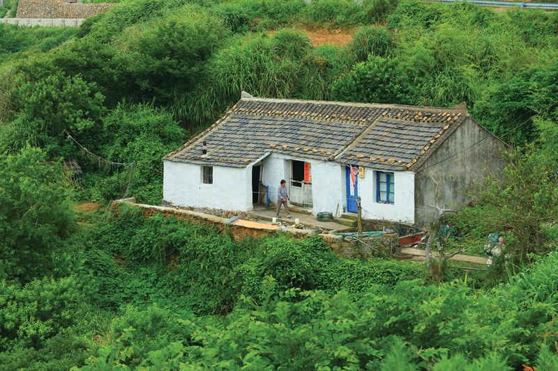 On the far side of the island, away from tourist development, Lighthouse village preserves Huaniao&#x27;s original architecture and fishing economy