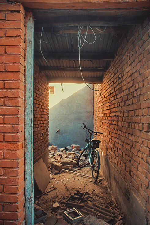A bike is still trapped in the alley as demolitions begin