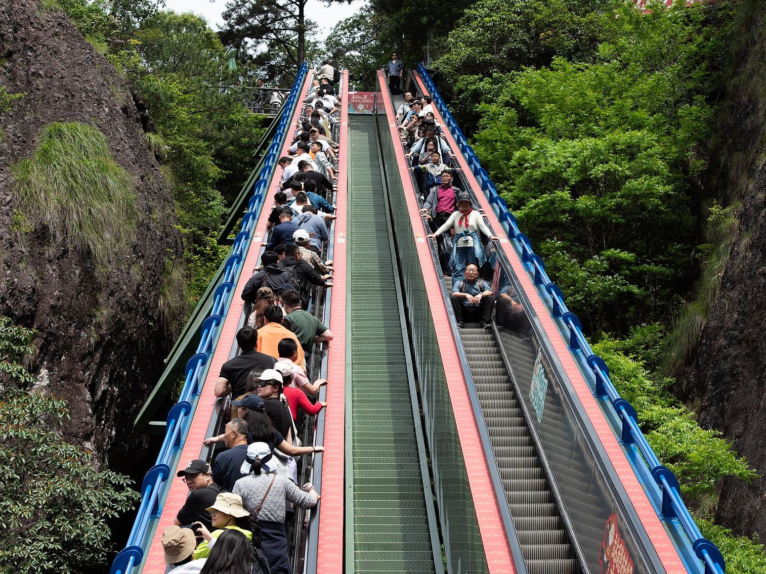 Tourists on escalator in China painless tourism