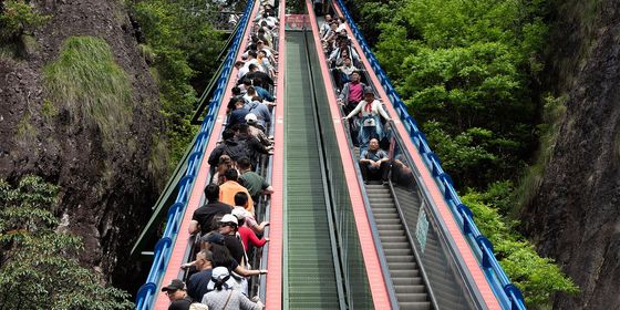 Tourists on escalator in China painless tourism