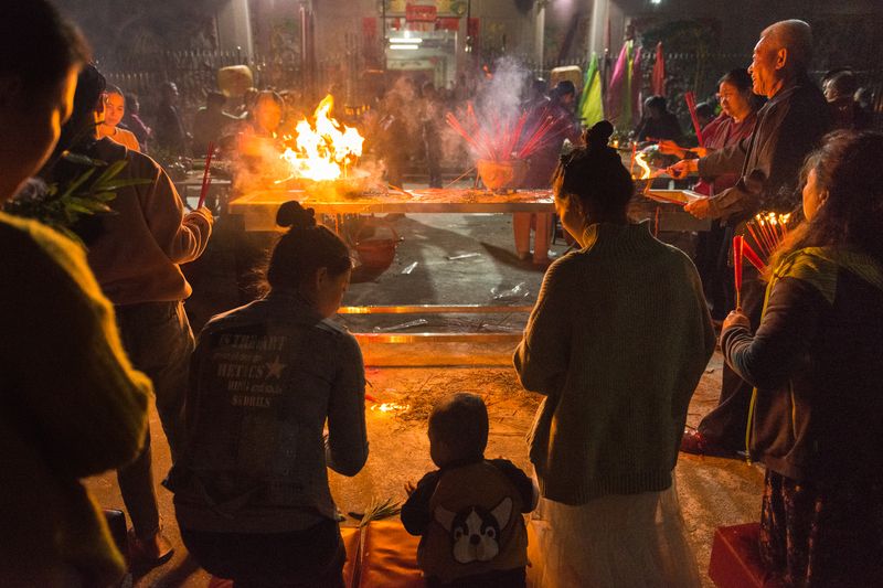 Villagers pray at their ancestral hall for a prosperous year to come, Lunar new year celebration fire ritual