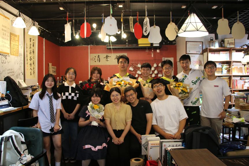 Tsing Bookstore employees alongside the owners Lu Qingqing and Chen Ran
