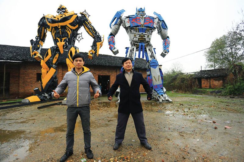 Yu Lingyun (left) and his dad Yu Zhilin have made a name for themselves crafting Transformers such as Bumblebee (left) and Optimus Prime