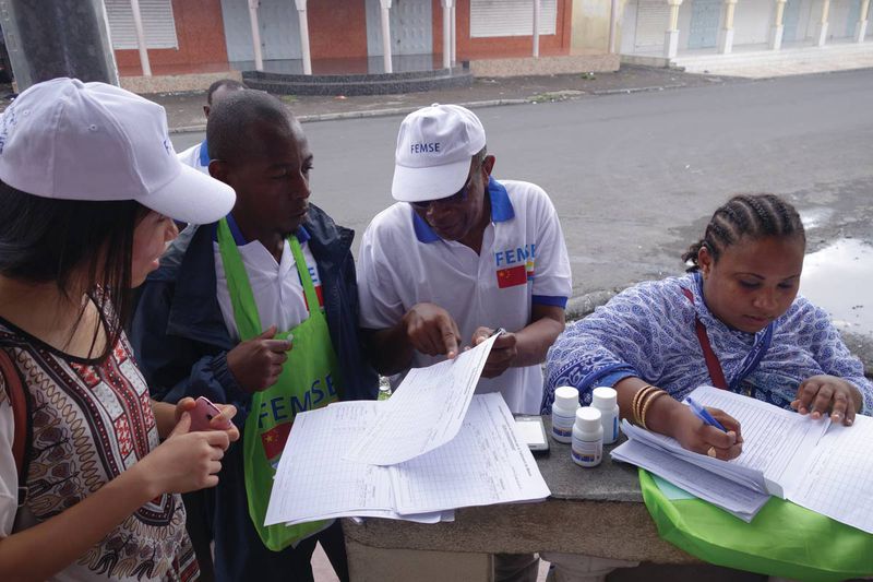 Local volunteers in Comoros assist with the distribution of Artequick